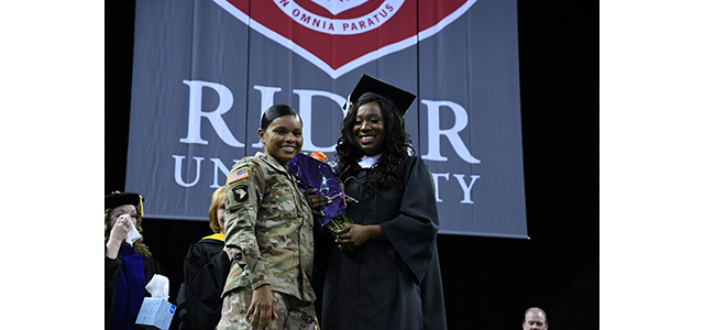 Sister Deployed to Iraq Surprises Rider University Graduate at Commencement